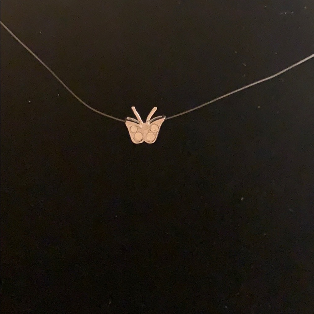 Butterfly pendant on filament